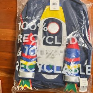 Mini Boden rocket ship back pack. Brand new. Still in the plastic wrapper.